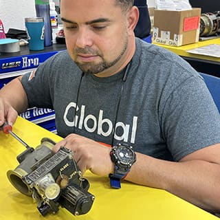 Global AirServices technicians working on aircraft components